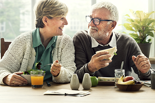 Retired couple enjoying breakfast