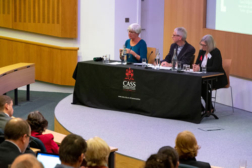 A three-person panel addresses audience questions.