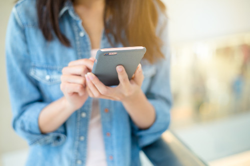 Young person using mobile phone