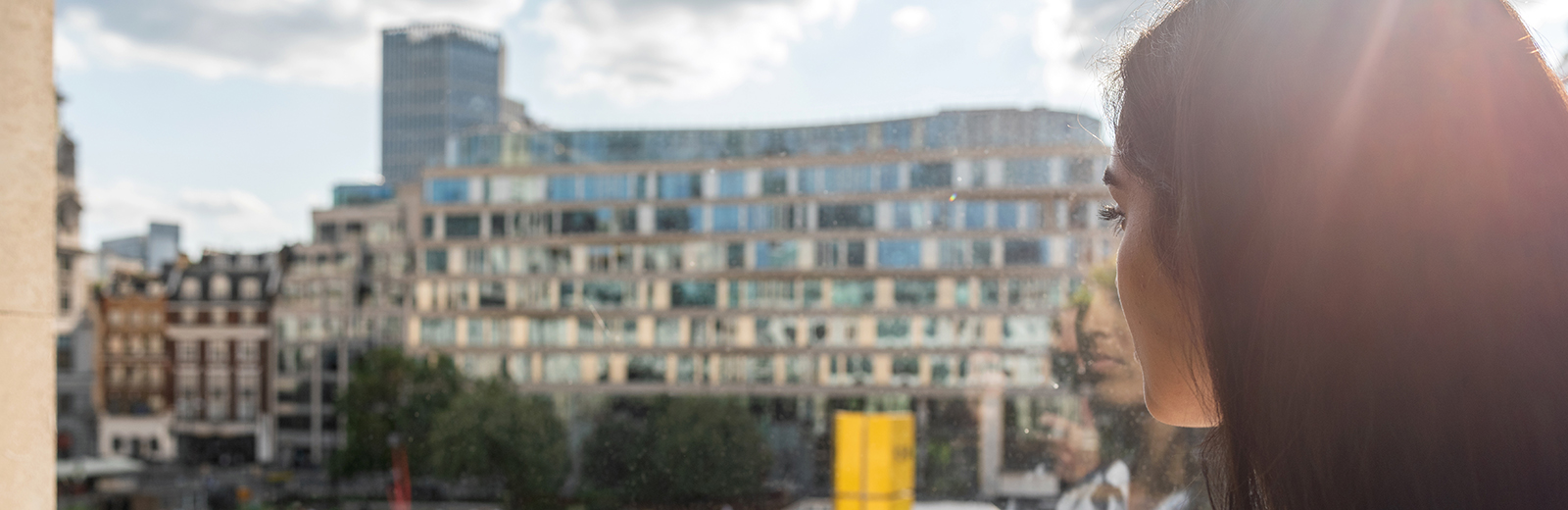 Girl looking out window towards Finsbury Sqaure 