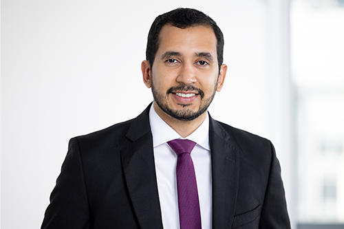 Headshot photo of Raul against a white background