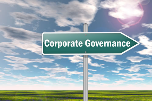 A sign pointing to Corporate Governance
