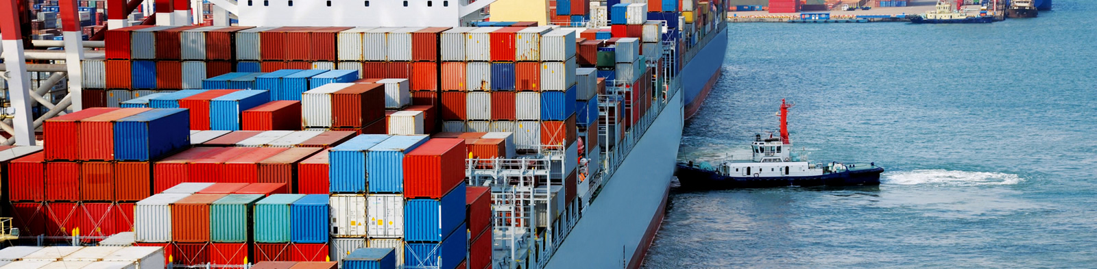 Cargo ship and tugs