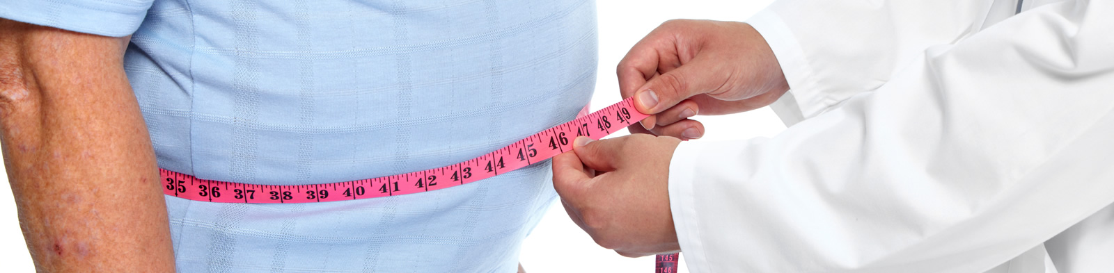 Doctor measuring patient's waist