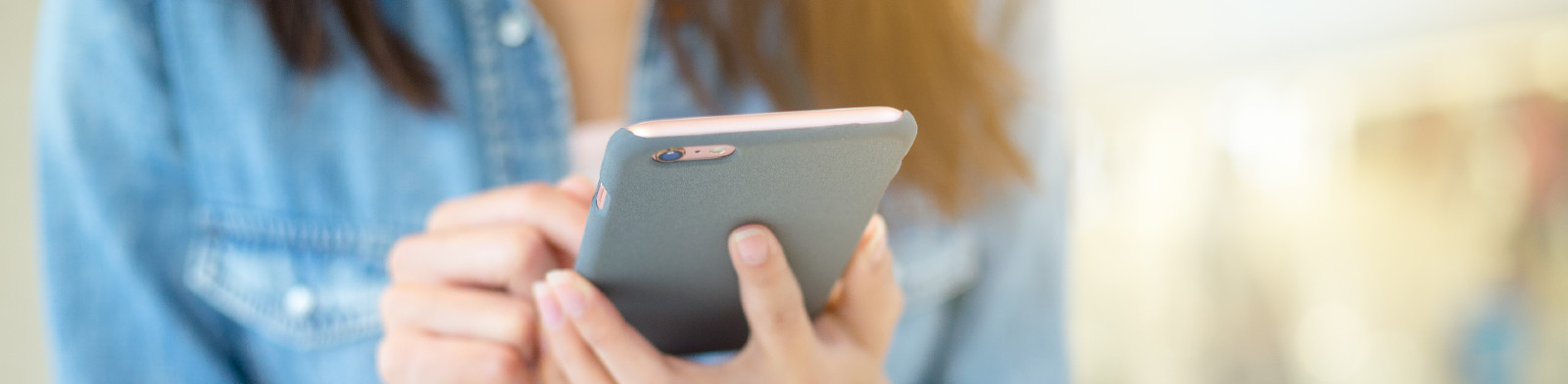 Young person using mobile phone