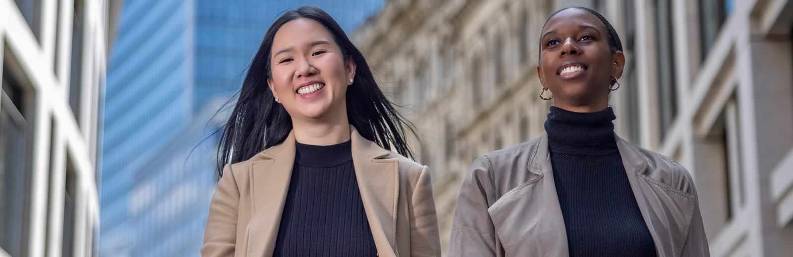 Two diverse female Bayes students walking together in the City of London.