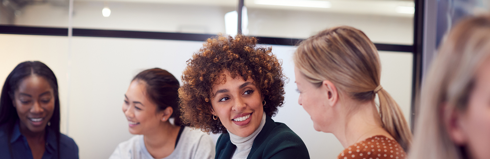 Woman talking and smiling to her peers