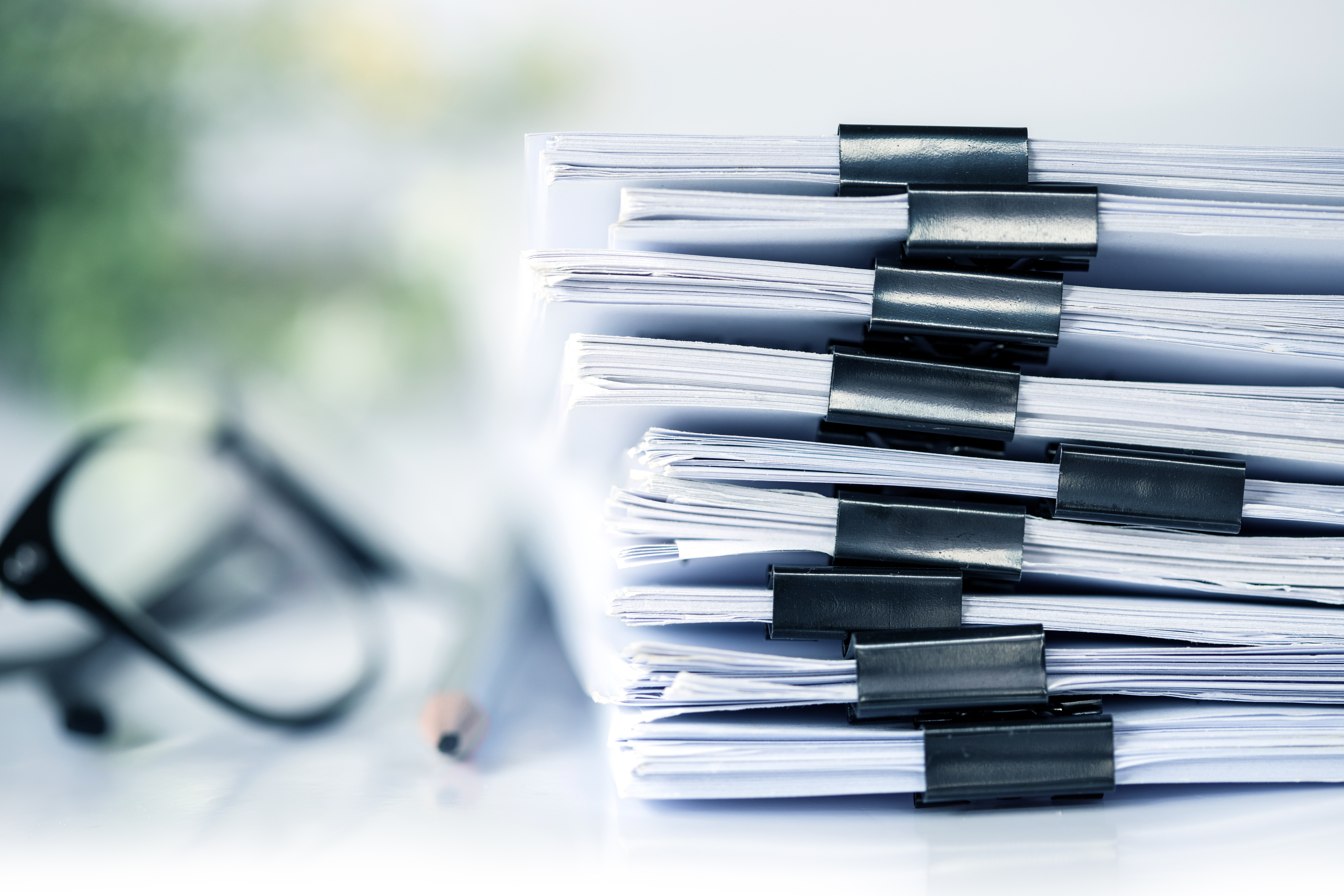 Images of books stacked up with faded background