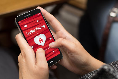 Woman using an online dating app on a smart phone