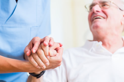 Elderly gentleman and carer