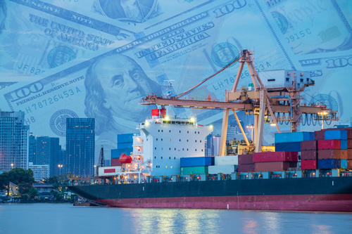 A cargo ship and a graphic of dollar bills