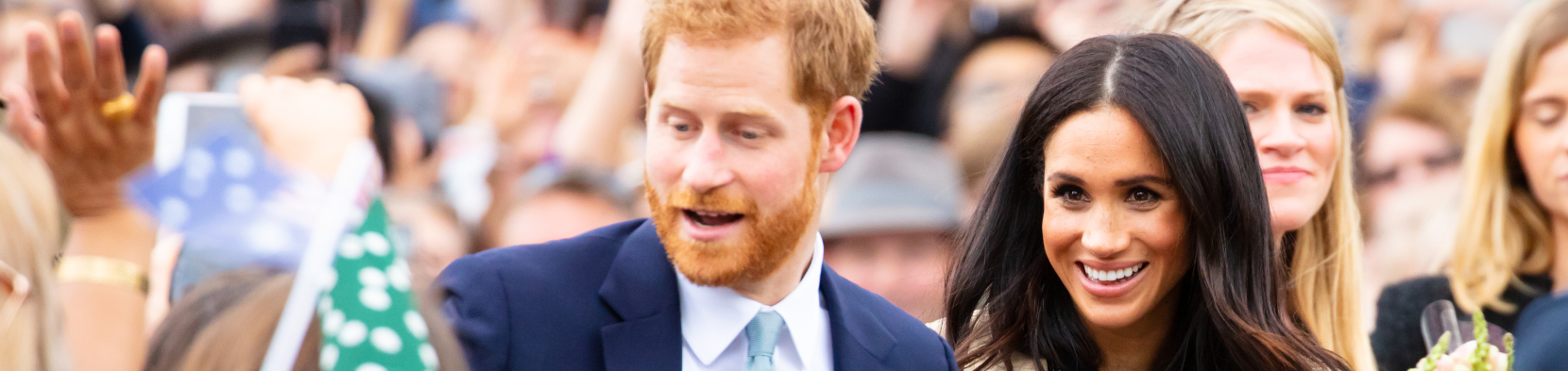 Harry and Meghan amidst a crowd