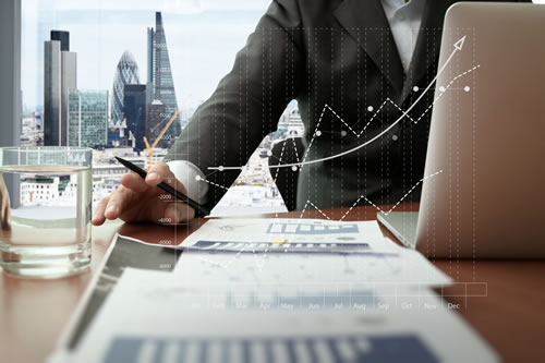 Businessman working through finances