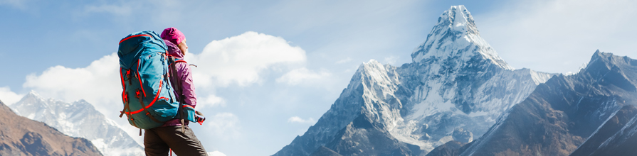 Hiker admiring the view from a mountaintop