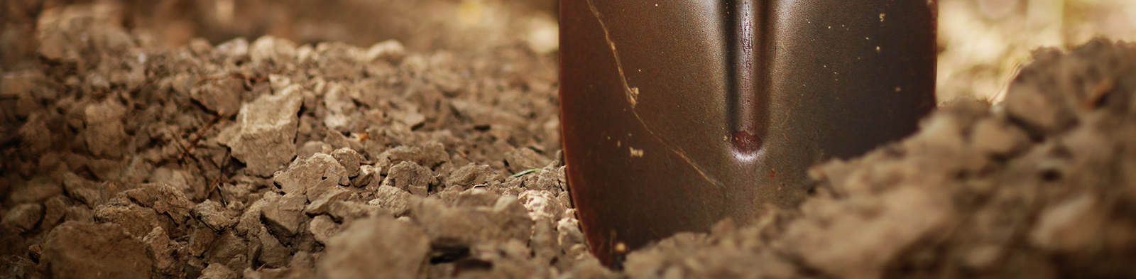 Spade digging into earth