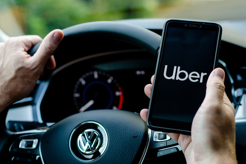 Uber driver checks his phone