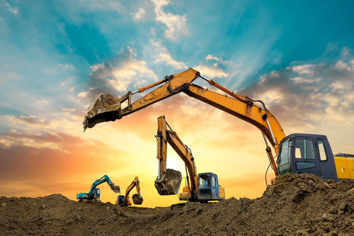 Excavators digging ground