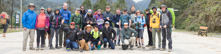 Group standing in front of Mount Fanispan in Vietnam