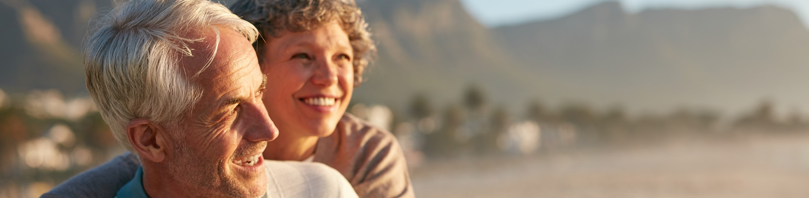Retired couple having fun on the beach