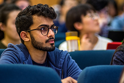 Young Asian male student in a lecture.