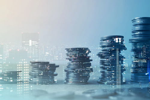 Stacks of coins against a city backdrop