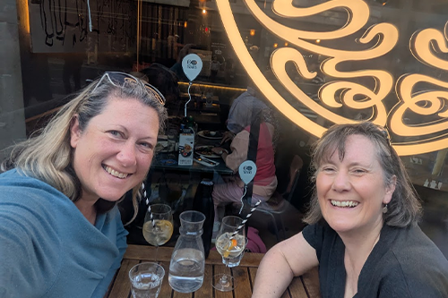 Photo of two ladies outside, the on the left is Anne