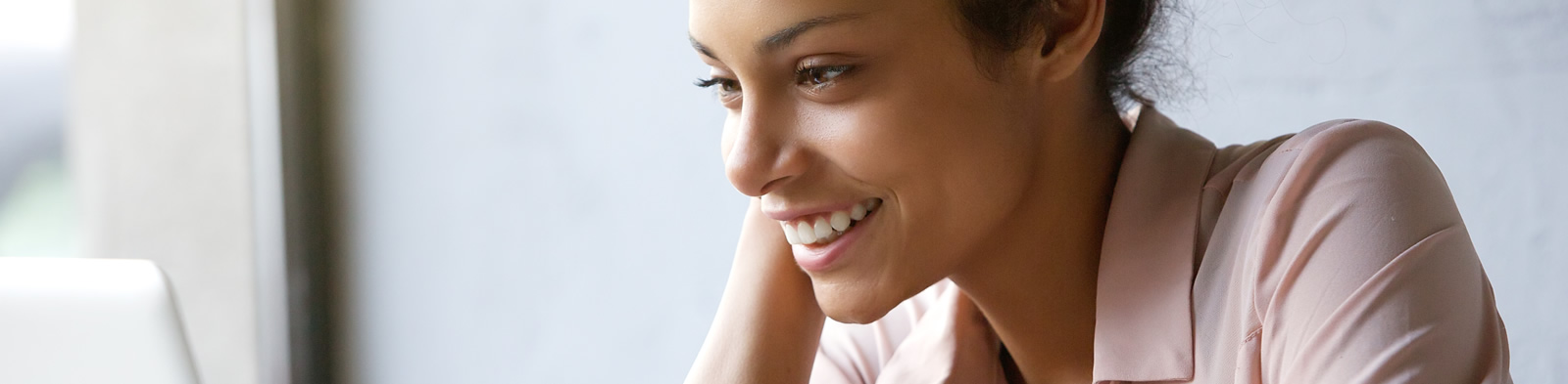 Woman playing game on computer