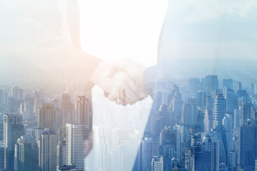 Business people shaking hands over a deal