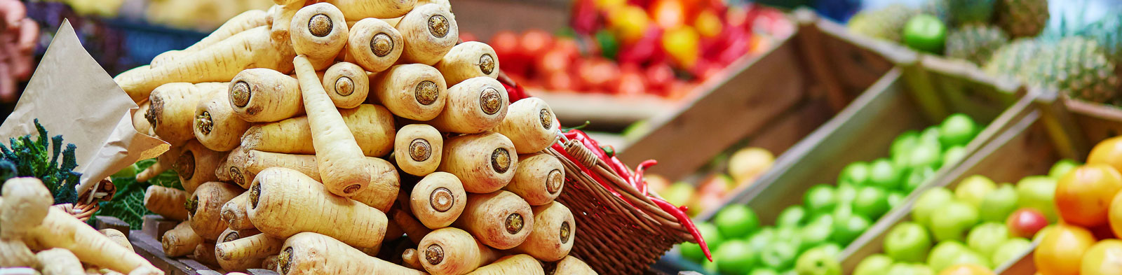 Parsnips and other fruit and veg at a market