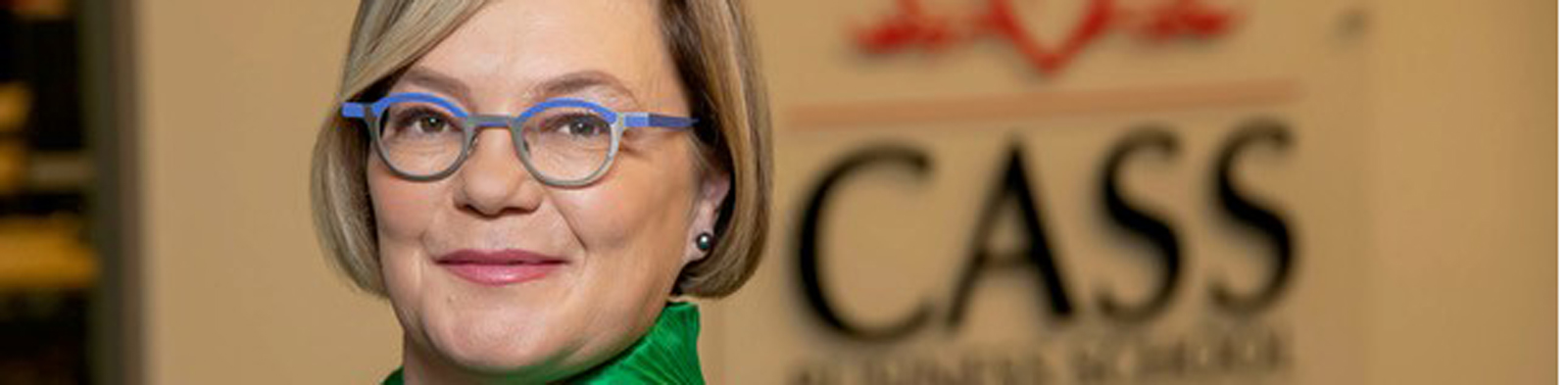 Professor Paula Jarzabkowski in front of Cass logo
