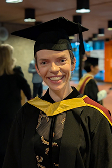 Stephanie Coughlin in graduation cap and gown.