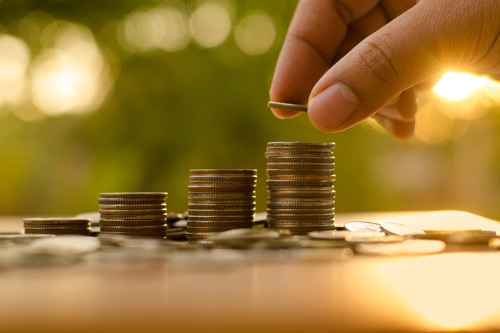 Stacking coins. Charity fundraising