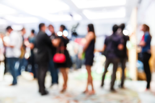 Blurred image of people mingling