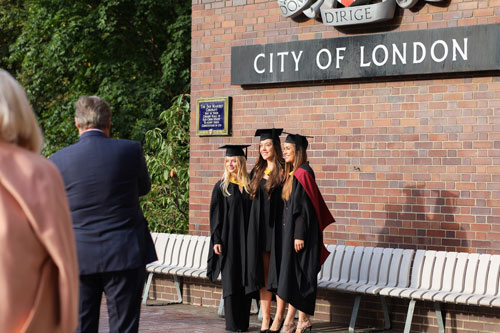 Three Bayes graduates pose at The Barbican Centre Three female Bayes graduates pose at The Barbican Centre