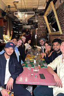 Students enjoying a meal together in the city