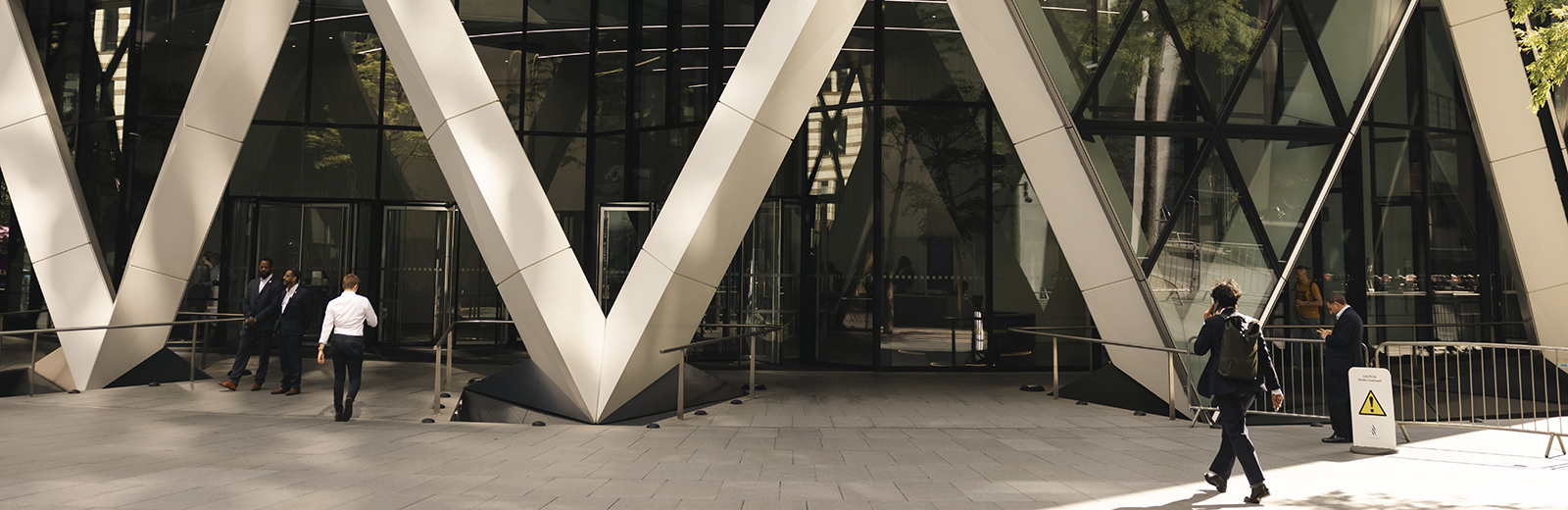 	People walking in to an office building in London