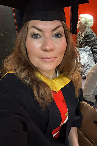 Amy wearing graduation outfit 