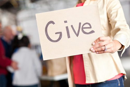 A sign saying "Give"