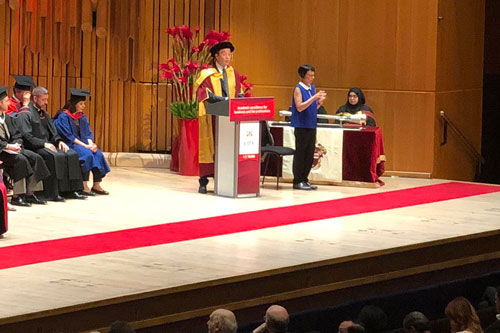 The CEO of Dow Jones, publisher of the Wall Street Journal, William Lewis delivers a speech to graduates at the 2019 Summer Graduations Ceremony at the Barbican Centre in London.