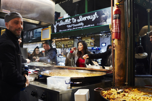 Student sampling food at Borough Market
