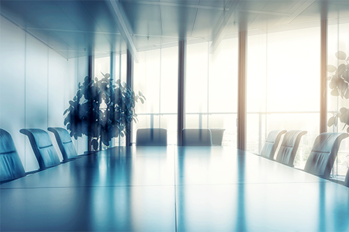 Empty meeting room with table and chairs