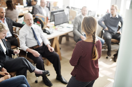 Manager presenting to her team