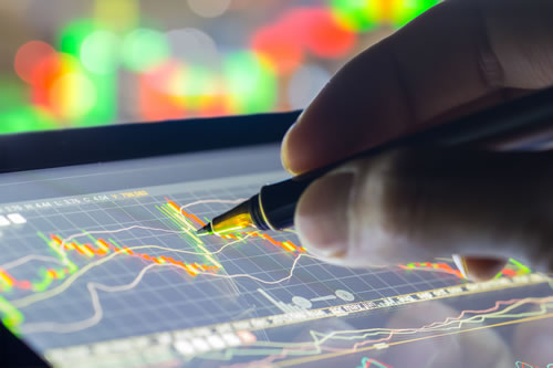 Financial analysis graphs on an electronic tablet
