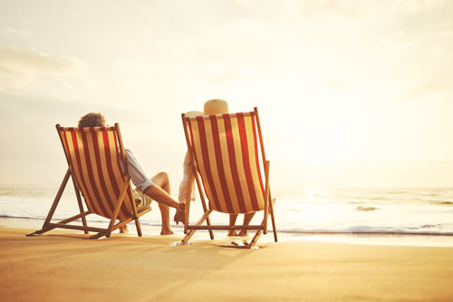 Retired couple enjoying the beach