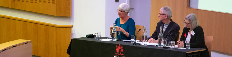 A three-person panel addresses audience questions.