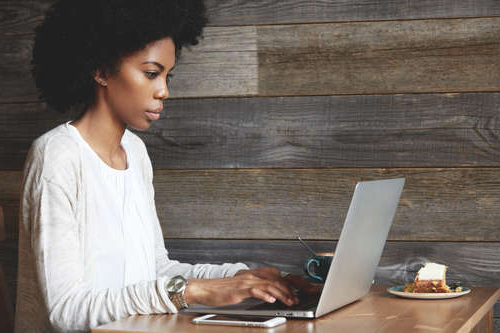 Girl completing application on laptop