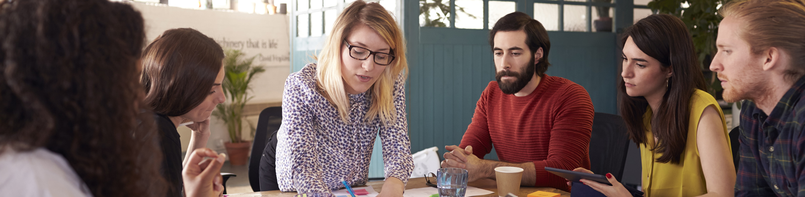 Employee owners in a business meeting