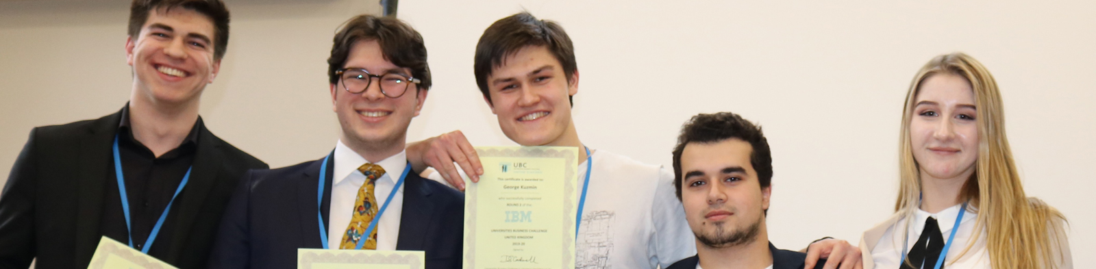 students line up with their certificates