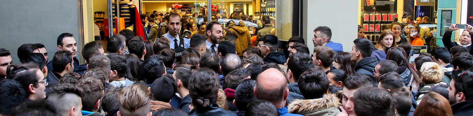Crowd gathering outside shop hoping to buy limited stock items
